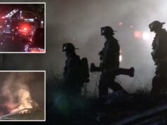 Pesadelo no trânsito de Los Angeles, pois 110 está fechado indefinidamente devido a incêndio em moradores de rua Foto noturna de veículos de emergência, incluindo um caminhão de bombeiros com uma escada estendida, respondendo a um incêndio em um túnel.