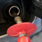 A motorist fills up the tank at a gas station in Glenview, Illinois, on May 14, 2026.