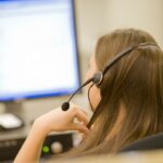 A photo of a call center representative taken from behind, used in a post about Operative Intelligence