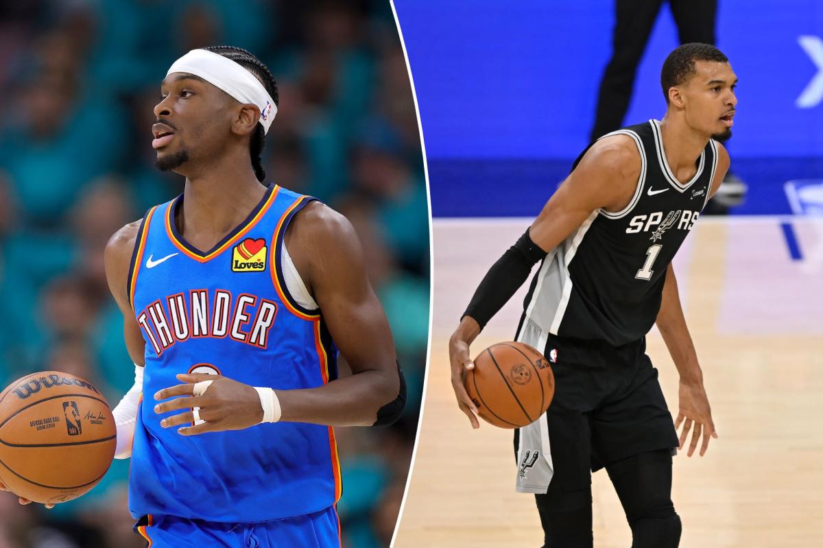 Shai Gilgeous-Alexander sendo ajudado por Jared McCain durante o terceiro jogo das finais da Conferência Oeste da NBA de 2026.
