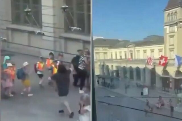 Um grupo de crianças e adultos caminhando na calçada.
