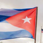 The Cuban national flag is seen during a protest in front of the U.S. Embassy in Havana on January 16, 2026.