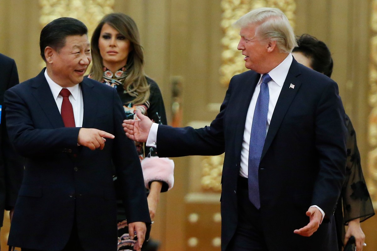 President Donald Trump boards Air Force One at Beijing Airport in China on November 10, 2017, to travel to Danang, Vietnam, during a five-country Asian trip. (AP Photo/Andrew Harnik)