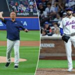 O arremessador do New York Mets, David Peterson, reage depois que o defensor esquerdo do Cincinnati Reds, JJ Bleday, marca quando a bola passa pelo apanhador do New York Mets, Luis Torrens, na sexta entrada.