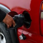A driver fills their gas tank with fuel at a gas station on May 9 in Houston. (Aaron M. Sprecher via AP)