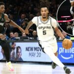 Stephon Castle, que marcou 32 pontos, ultrapassou Anthony Edwards durante a vitória dos Spurs por 139-109 no Jogo 6 da série sobre os Timberwolves em 15 de maio de 2026 em Minneapolis.