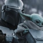 STAR WARS: THE MANDALORIAN AND GROGU, from left: Pedro Pascal as The Mandalorian / Din Djarin, Grogu, 2026. © Walt Disney Studios Motion Pictures / Courtesy Everett Collection