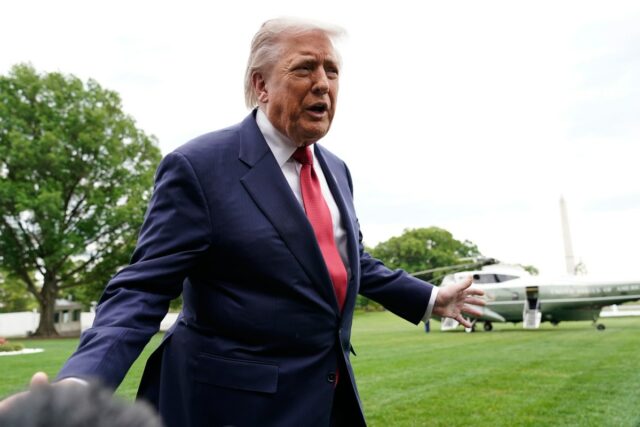 President Donald Trump speaks to reporters as he walks to board Marine One on the South Lawn of the White House, Friday, May 8, 2026, in Washington.
