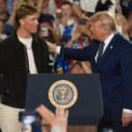NFL quarterback Jaxson Dart, with the New York Giants introduces President Donald Trump during a