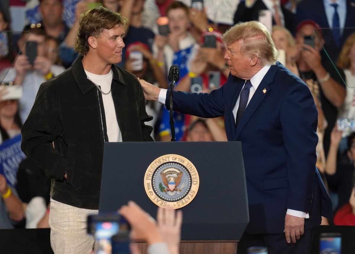 NFL quarterback Jaxson Dart, with the New York Giants introduces President Donald Trump during a