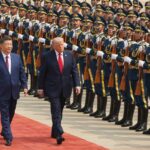 President Donald Trump, right, participates in a welcome ceremony with China's President Xi Jinping at the Great Hall of the People on May 14, 2026, in Beijing.