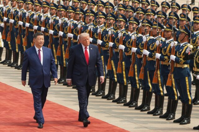 President Donald Trump, right, participates in a welcome ceremony with China's President Xi Jinping at the Great Hall of the People on May 14, 2026, in Beijing.
