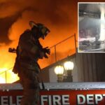 Um enorme inferno irrompe no centro de Los Angeles enquanto 100 bombeiros correm para o local