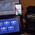 An engineer shows devices and explains the technology developed by the Israeli firm Cellebrite.