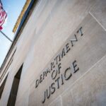 A U.S. flag flies on the Department of Justice building on September 15, 2024, in Washington, D.C.