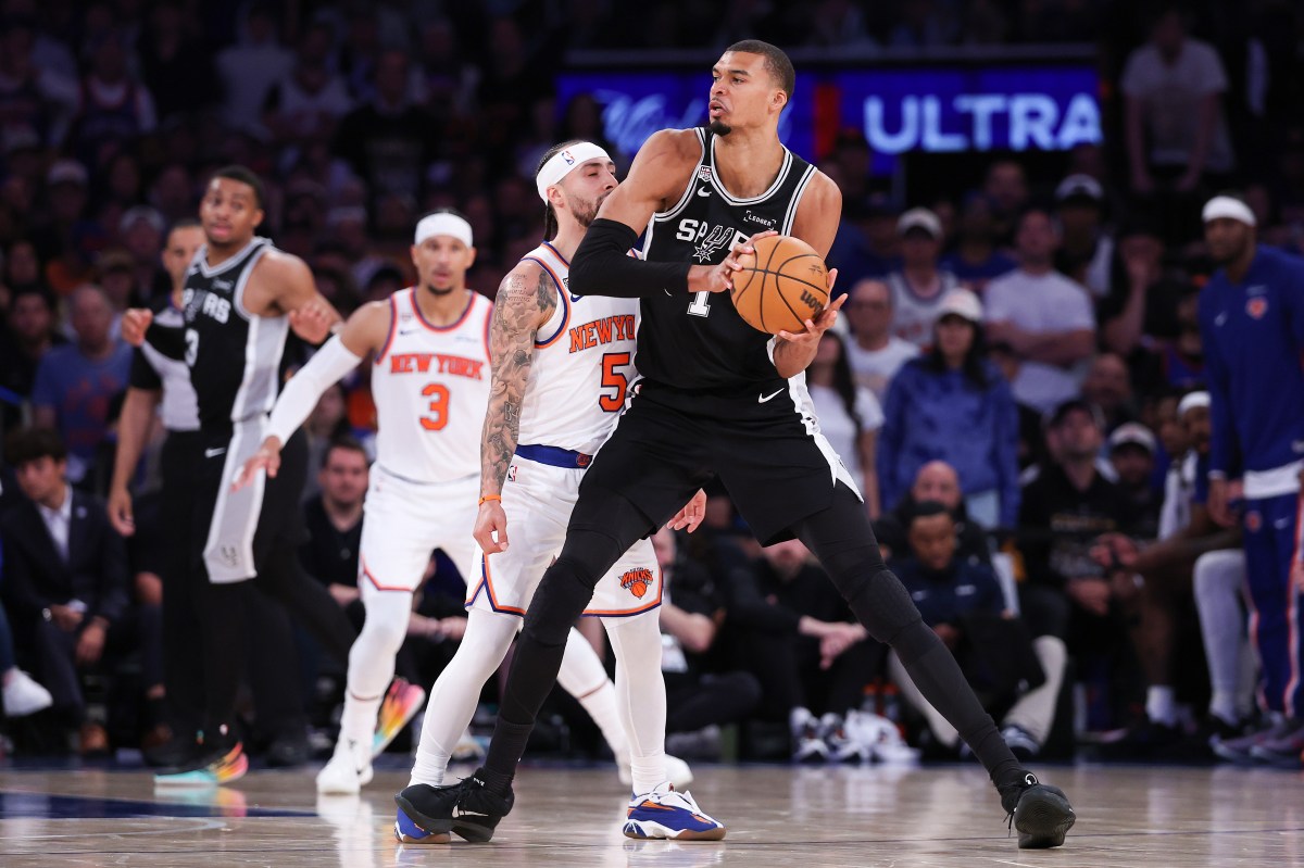 Spurs player Victor Wembanyama against the New York Knicks' Jose Alvarado in the NBA Finals