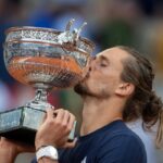 PARIS, FRANCE - JUNE 07: Alexander Zverev of Germany with the winners' trophy after his victory against Flavio Cobolli of Italy in the Men's Singles Final on Court Philippe Chatrier at the 2026 French Open Tennis Tournament at Roland Garros on June 7th, 2026, in Paris, France. (Photo by Tim Clayton/Getty Images)