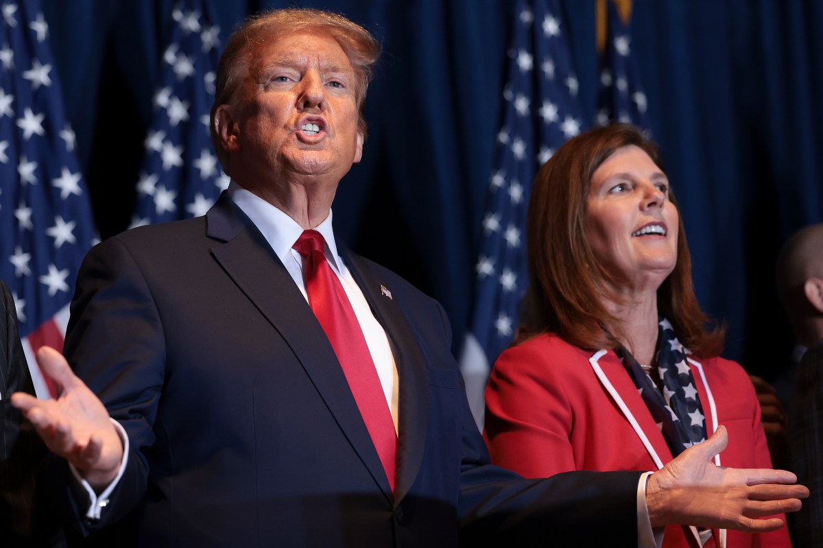 Then-Republican presidential candidate and former President Donald Trump gestures to supporters, beside South Carolina Lieutenant Governor Pamela Evette, during an election night watch party at the State Fairgrounds on February 24, 2024, in Columbia, South Carolina. (Photo by Win McNamee/Getty Images)