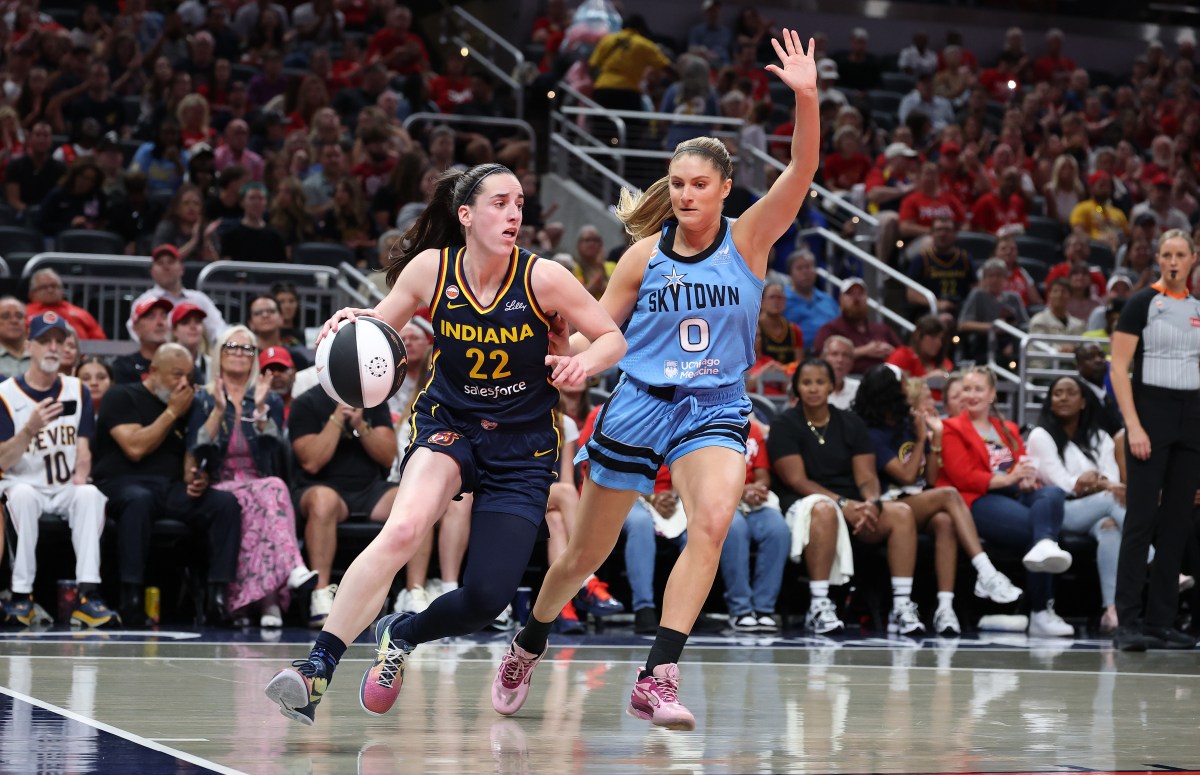 Fever star Caitlin Clark drives against Chicago Sky player Jacy Sheldon