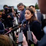 Representative Alexandria Ocasio-Cortez addresses reporters as she arrives for the final votes of the week at the U.S. Capitol on May 21 in Washington, D.C. (Photo by Andrew Harnik/Getty Images)