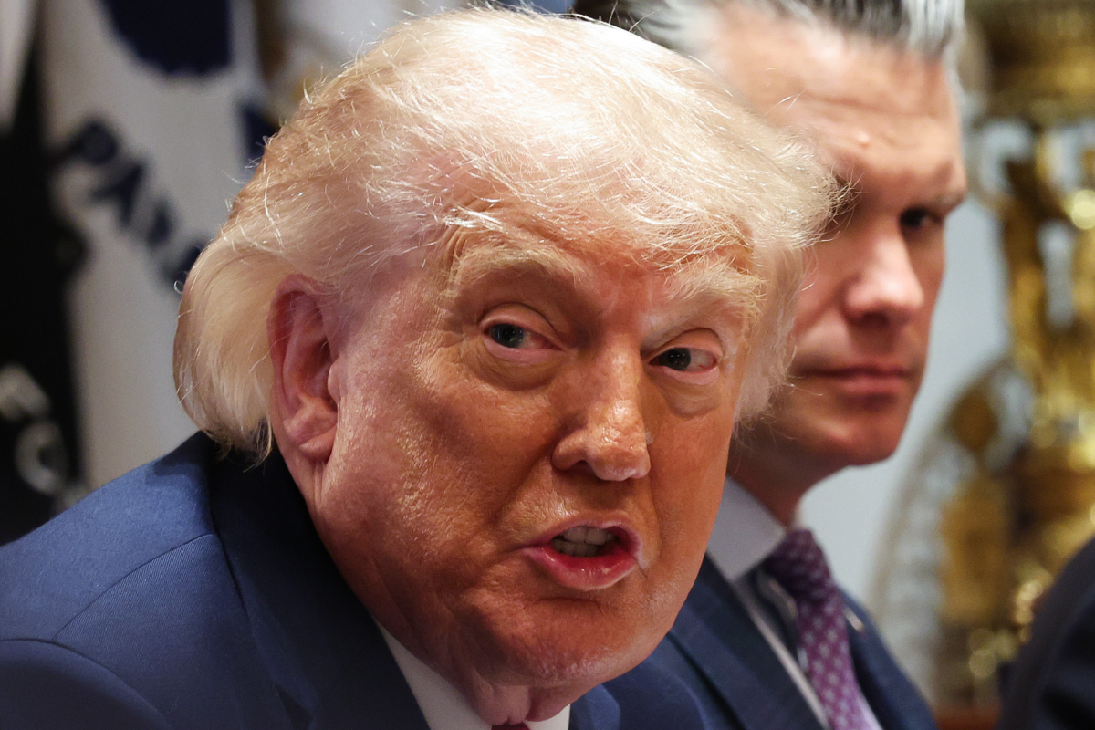 Donald Trump speaks as U.S. Secretary of War Pete Hegseth (R) listens during a Cabinet meeting in the Cabinet Room of the White House on May 27, 2026 in Washington, DC.