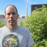 Jake Fortes, standing in front of the data center next to his home in Lowell, Massachusetts.