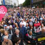 People gather during an anti-racism rally outside Belfast City Hall sparked by a knife attack on a man in north Belfast on Monday in Belfast on June 13. (Peter Morrison/PA via AP)