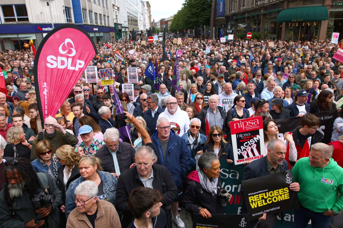 People gather during an anti-racism rally outside Belfast City Hall sparked by a knife attack on a man in north Belfast on Monday in Belfast on June 13. (Peter Morrison/PA via AP)