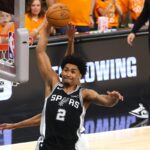 SAN ANTONIO, TEXAS - JUNE 03: Dylan Harper #2 of the San Antonio Spurs attempts to dunk the ball against Mikal Bridges #25 of the New York Knicks during the first quarter in Game One of the 2026 NBA Finals at Frost Bank Center on June 03, 2026 in San Antonio, Texas. (Photo by Gregory Shamus/Getty Images)