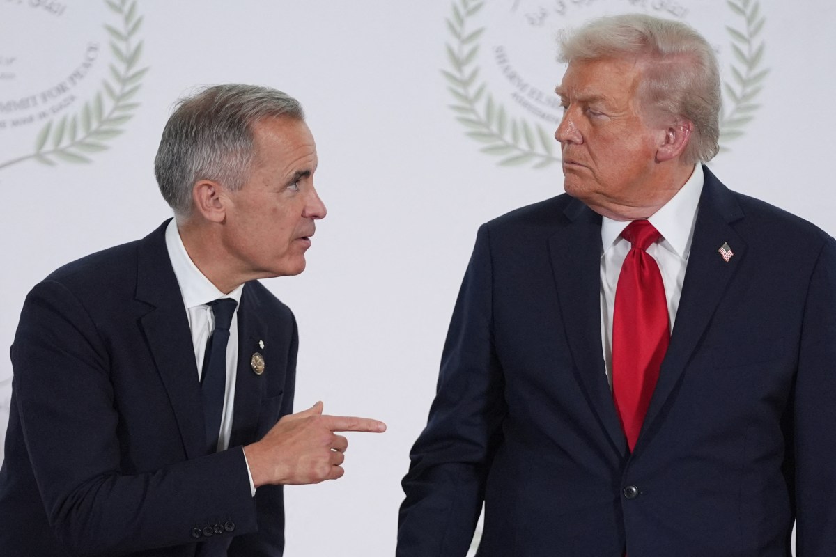 US President Donald Trump greets Canada's Prime Minister Mark Carney during a summit on Gaza in Sharm el-Sheikh on October 13, 2025.
