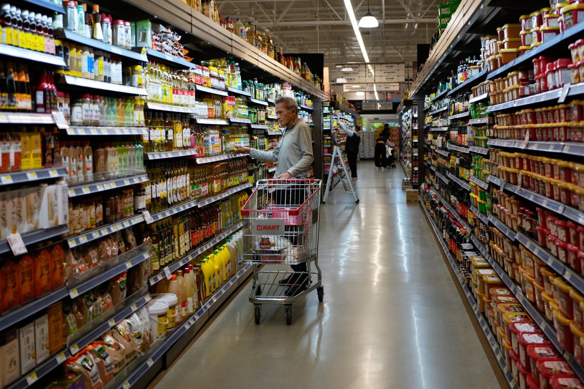 People shop at a grocery store in Schaumburg, Illinois, Thursday, May 14, 2026.