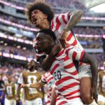 LOS ANGELES, CALIFORNIA - JUNE 12: Folarin Balogun #20 of the United States celebrates scoring his team's third goal during the FIFA World Cup 2026 Group D match between USA and Paraguay at Los Angeles Stadium on June 12, 2026 in Los Angeles, California. (Photo by Richard Heathcote/Getty Images)