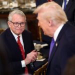 Ohio Governor Mike DeWine applauds as President Donald Trump arrives for a working breakfast with governors in the State Dining Room at the White House on February 20, 2026 in Washington, DC.