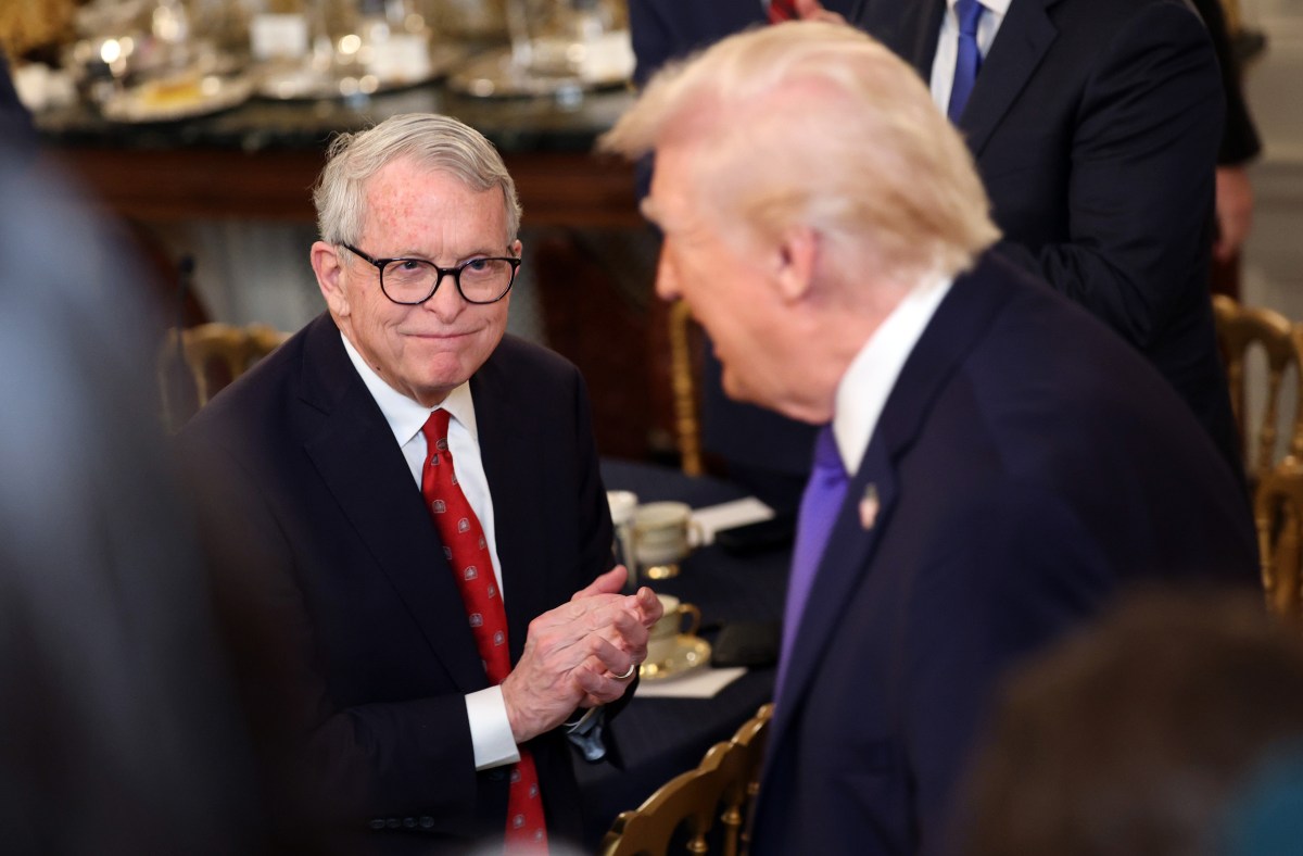 Ohio Governor Mike DeWine applauds as President Donald Trump arrives for a working breakfast with governors in the State Dining Room at the White House on February 20, 2026 in Washington, DC.