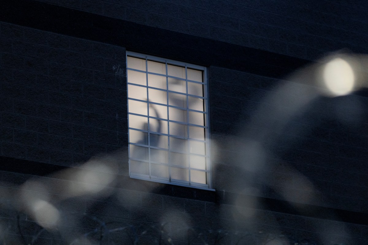 As part of a nightly tradition, imprisoned immigrants greet immigration activists from windows as ICE agents and pro-immigration activists face off outside the Delaney Hall Immigration Detention Center on May 27, 2026, in Newark, New Jersey.