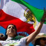 People protest FIFA's ban of Iran's pre-revolutionary flags inside World Cup stadiums in Inglewood, California, on Sunday.