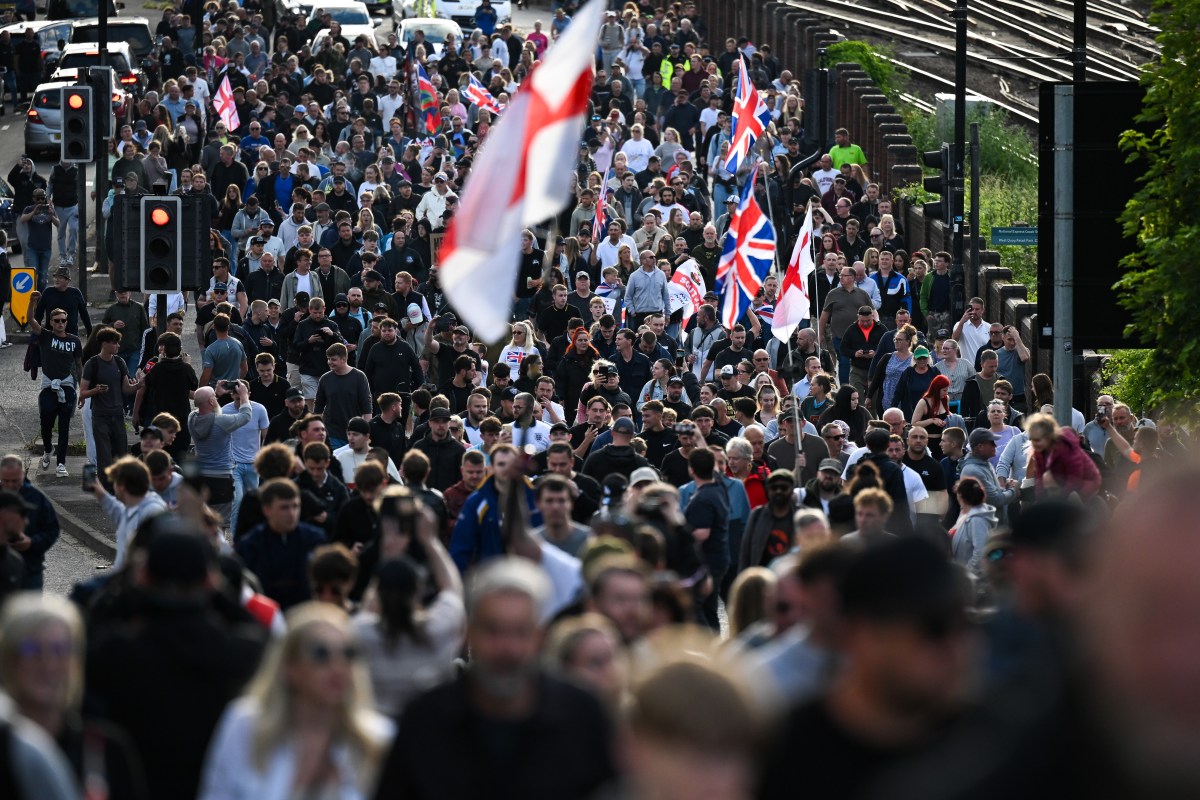 People march through the city after a protest over the police's handling of the arrest of Henry Nowak, at Southampton Central Police Station on June 2, 2026, in Southampton, England.