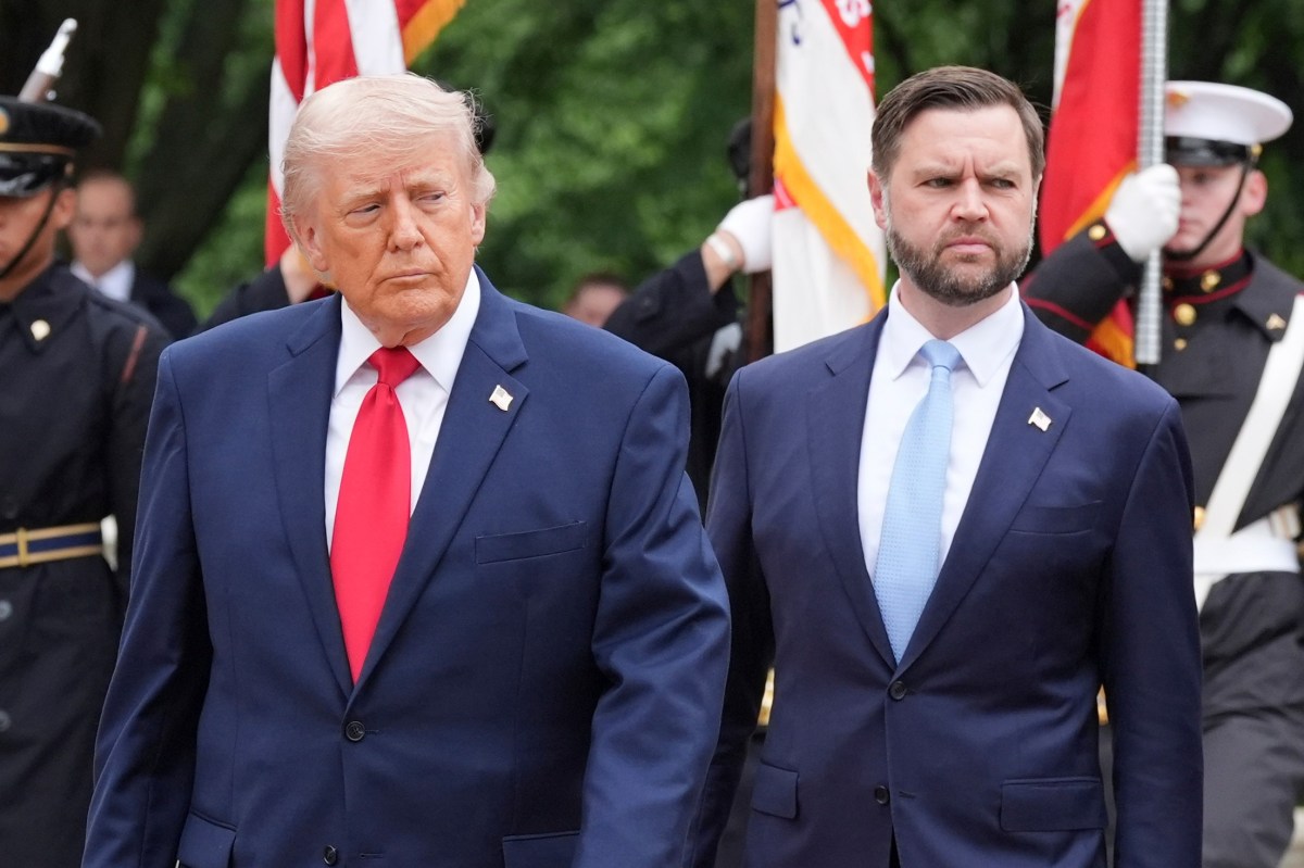 President Donald Trump and Vice President JD Vance walk to the Tomb of the Unknown Soldier in Arlington National Cemetery on Memorial Day, Monday, May 25, 2026, in Arlington, Va.