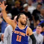 SAN ANTONIO, TEXAS - JUNE 13: Jalen Brunson #11 of the New York Knicks reacts after his made three-point basket against the San Antonio Spurs during the second quarter in Game Five of the 2026 NBA Finals at Frost Bank Center on June 13, 2026 in San Antonio, Texas. (Photo by Gregory Shamus/Getty Images)