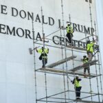 Workers get busy on the signage for the Kennedy Center in Washington, D.C., on Friday. (Photo by Alex Wroblewski/AFP via Getty Images)