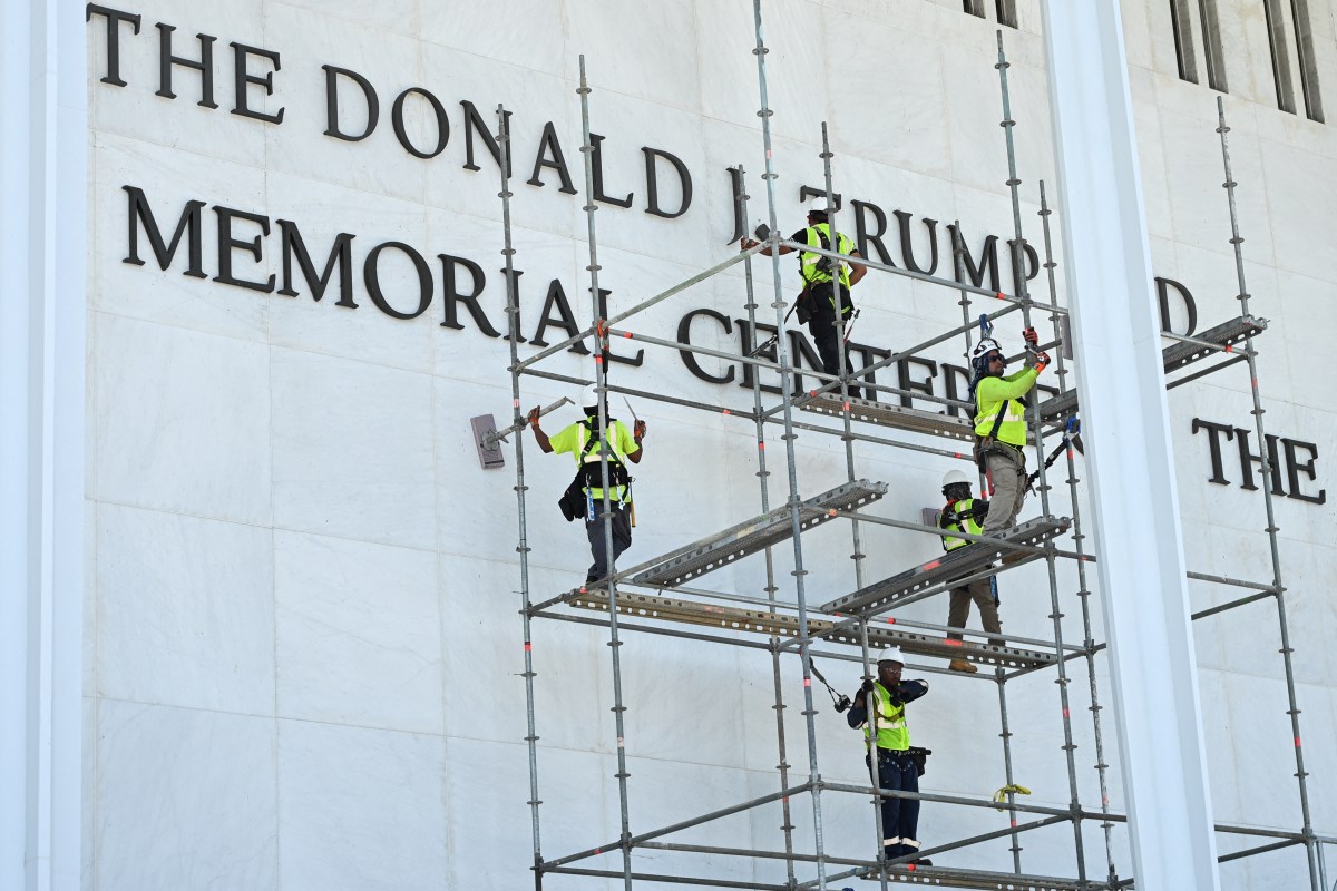 Workers get busy on the signage for the Kennedy Center in Washington, D.C., on Friday. (Photo by Alex Wroblewski/AFP via Getty Images)