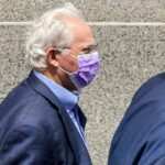 Former U.S. Rep. Stephen Buyer, left, trails his lawyer as he leaves Manhattan federal court after pleading not guilty to charges that he participated in an insider-trading scheme while working as a consultant, July 27, 2022, in New York.