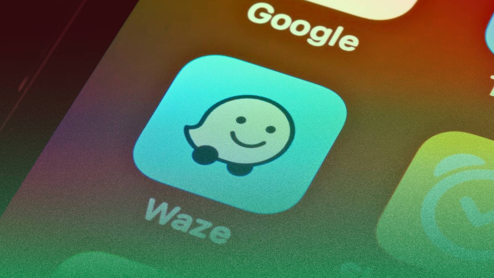 ícone waze no smartphone em fundo amarelo azul e vermelho