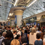 Commuters wait at a packed New York Penn Station as trains are delayed and cancelled on June 11, 2026 in New York.