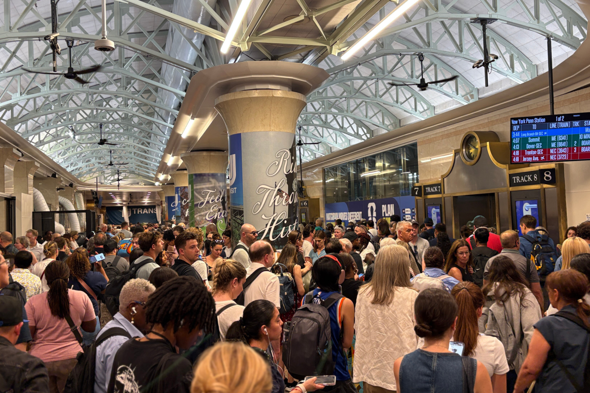 Commuters wait at a packed New York Penn Station as trains are delayed and cancelled on June 11, 2026 in New York.