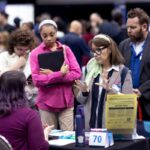 CHICAGO, ILLINOIS - SEPTEMBER 17: Job seekers are coached on interview practices with Amazon during a career fair held at Vertiport Chicago on September 17, 2019 in Chicago, Illinois. The event was one of several Amazon career fairs held across the country today as the company attempts to fill more than 30,000 full and part-time positions. (Photo by Scott Olson/Getty Images)