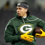 CHICAGO, ILLINOIS - JANUARY 10: Christian Watson #9 of the Green Bay Packers warms up before the game against the Chicago Bears in the NFC Wild Card Playoff game at Soldier Field on January 10, 2026 in Chicago, Illinois.  (Photo by Patrick McDermott/Getty Images)