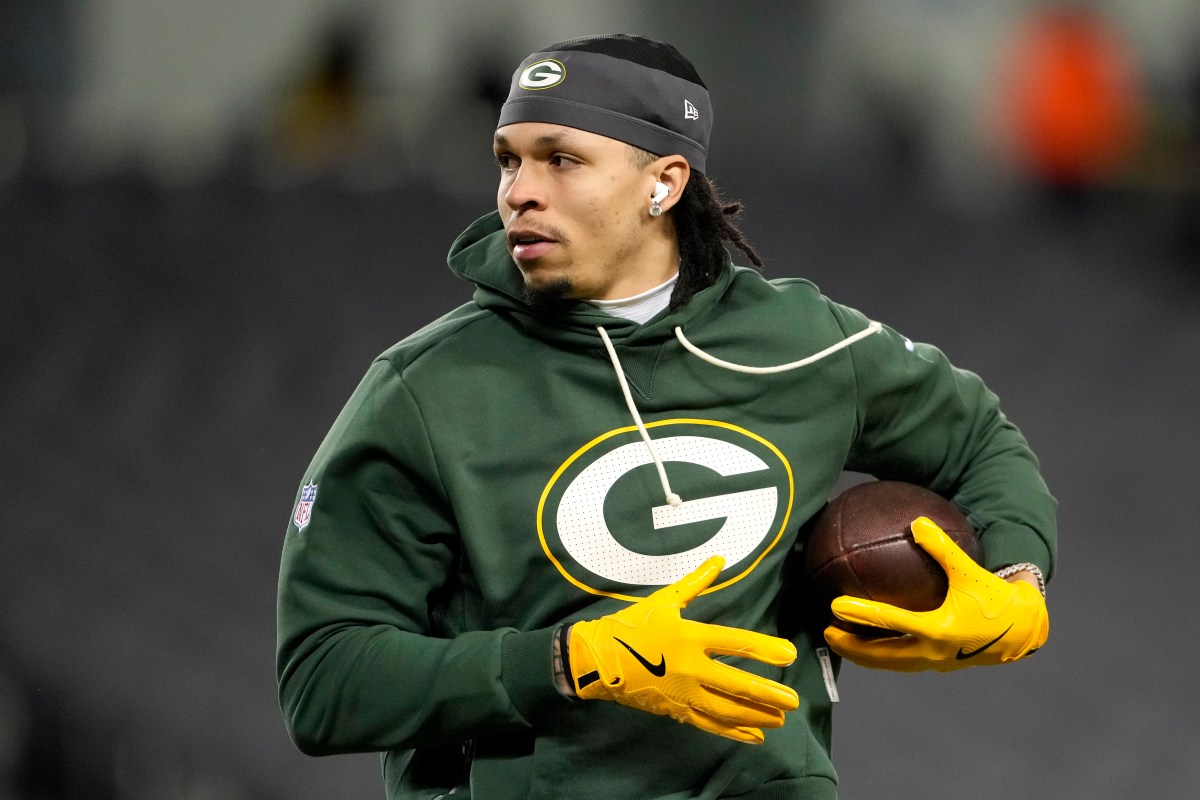 CHICAGO, ILLINOIS - JANUARY 10: Christian Watson #9 of the Green Bay Packers warms up before the game against the Chicago Bears in the NFC Wild Card Playoff game at Soldier Field on January 10, 2026 in Chicago, Illinois.  (Photo by Patrick McDermott/Getty Images)