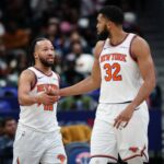 WASHINGTON, DC - FEBRUARY 03: Jalen Brunson #11 and Karl-Anthony Towns #32 of the New York Knicks celebrate after a play against the Washington Wizards during the second half at Capital One Arena on February 3, 2026 in Washington, DC.  (Photo by Scott Taetsch/Getty Images)
