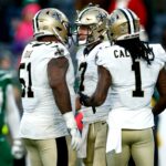 EAST RUTHERFORD, NEW JERSEY - DECEMBER 12: Cesar Ruiz #51 and Marquez Callaway #1 of the New Orleans Saints congratulate teammate Taysom Hill #7 after Hill scored on a 44-yard rushing touchdown against the New York Jets during the fourth quarter at MetLife Stadium on December 12, 2021 in East Rutherford, New Jersey. (Photo by Sarah Stier/Getty Images)